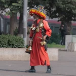 The Traditional Water Seller in Morocco: A Living Symbol of Culture and Heritage Walking through the old medinas of Morocco—especially in cities like Marrakech, Fes, Rabat, and Meknes—you may encounter a striking figure dressed in colorful traditional clothing, carrying brass cups and a decorated water container. This is the traditional Moroccan water seller, one of the most iconic symbols of Morocco’s rich cultural heritage. A Tradition Rooted in History The profession of the water seller dates back centuries, long before modern plumbing existed in Moroccan cities. At that time, access to fresh drinking water was limited, and water sellers played a vital role in daily life by providing clean water to locals, travelers, and merchants in the medina. They would collect water from natural springs, fountains, or public wells and distribute it throughout the city. Their presence ensured survival in Morocco’s warm climate and became an essential service within urban life. More Than a Job – A Cultural Identity Today, the water seller is no longer a necessity but remains a living tradition and an important part of Moroccan identity. You will often see them near busy squares, historic sites, or tourist areas, especially in Jemaa el-Fnaa Square in Marrakech, where culture, history, and daily life blend together. Their traditional outfit—often featuring a wide-brimmed hat adorned with colorful tassels—along with the sound of clinking metal cups, attracts visitors and photographers from around the world. A Symbol of Authentic Morocco For travelers seeking authentic Moroccan experiences, encountering a water seller is a reminder of Morocco’s deep respect for tradition and heritage. It reflects a time when community, simplicity, and human connection were at the heart of everyday life. Taking a photo with a water seller is not just a travel moment—it is a connection to Morocco’s past, preserved in the present. Experiencing Local Life with Moroccan Odyssey At Moroccan Odyssey, we believe true travel goes beyond monuments and landscapes. We design private and customized tours that immerse our guests in Morocco’s local traditions, daily life, and cultural stories. From walking through ancient medinas to meeting local artisans and witnessing timeless traditions like the water seller, our tours offer a deeper understanding of Morocco—guided by knowledgeable locals who share the heart of the country.