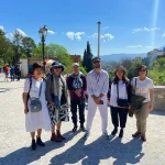 Discovering Chefchaouen’s Blue City on a 12-Day Private Morocco Tour with Moroccan Odyssey Chefchaouen, known worldwide as the Blue City of Morocco, is one of the most charming and photogenic destinations in the country. Nestled in the Rif Mountains, this peaceful town attracts travelers looking for culture, beauty, and authentic Moroccan experiences. During their 12-day private Morocco tour, our guests — a sisters’ family from Singapore — enjoyed a guided visit through the blue streets of Chefchaouen with Moroccan Odyssey. This picture captures a special moment of their journey: smiling faces, relaxed energy, and the joy of discovering one of Morocco’s most iconic cities with a local professional tour guide. Walking through the narrow blue-painted alleys, the family explored traditional neighborhoods, small artisan shops, and scenic viewpoints overlooking the old medina. Why Chefchaouen Is a Highlight of a Private Morocco Tour Chefchaouen is famous for its blue-washed walls, Andalusian architecture, and calm atmosphere. Unlike busy imperial cities, the Blue City offers a slower pace, making it ideal for families, sisters traveling together, and private tours. With Moroccan Odyssey, guests benefit from a customized itinerary, allowing enough time to enjoy photography, local culture, and authentic interactions. During this visit, our guide shared stories about the city’s history, its Andalusian roots, and daily life in northern Morocco. The sisters and their family enjoyed exploring at their own rhythm, which is one of the biggest advantages of choosing a 12-day private tour package in Morocco. A 12-Day Morocco Tour Designed for Comfort and Authenticity This Chefchaouen experience was part of a 12-day private Morocco tour package, carefully designed by Moroccan Odyssey to combine comfort, culture, and unforgettable memories. From the north to the south of Morocco, guests experience imperial cities, mountain landscapes, desert adventures, and charming towns like Chefchaouen. As seen in the picture, the sisters’ family felt relaxed and connected, enjoying a stress-free journey with a trusted Moroccan travel agency, private transportation, and an experienced English-speaking guide. Why Choose Moroccan Odyssey Moroccan Odyssey specializes in private Morocco tours, offering personalized service for families, couples, and small groups from around the world, including travelers from Singapore and Southeast Asia. Every tour is designed with care, flexibility, and attention to detail, ensuring guests enjoy Morocco in a meaningful and comfortable way.