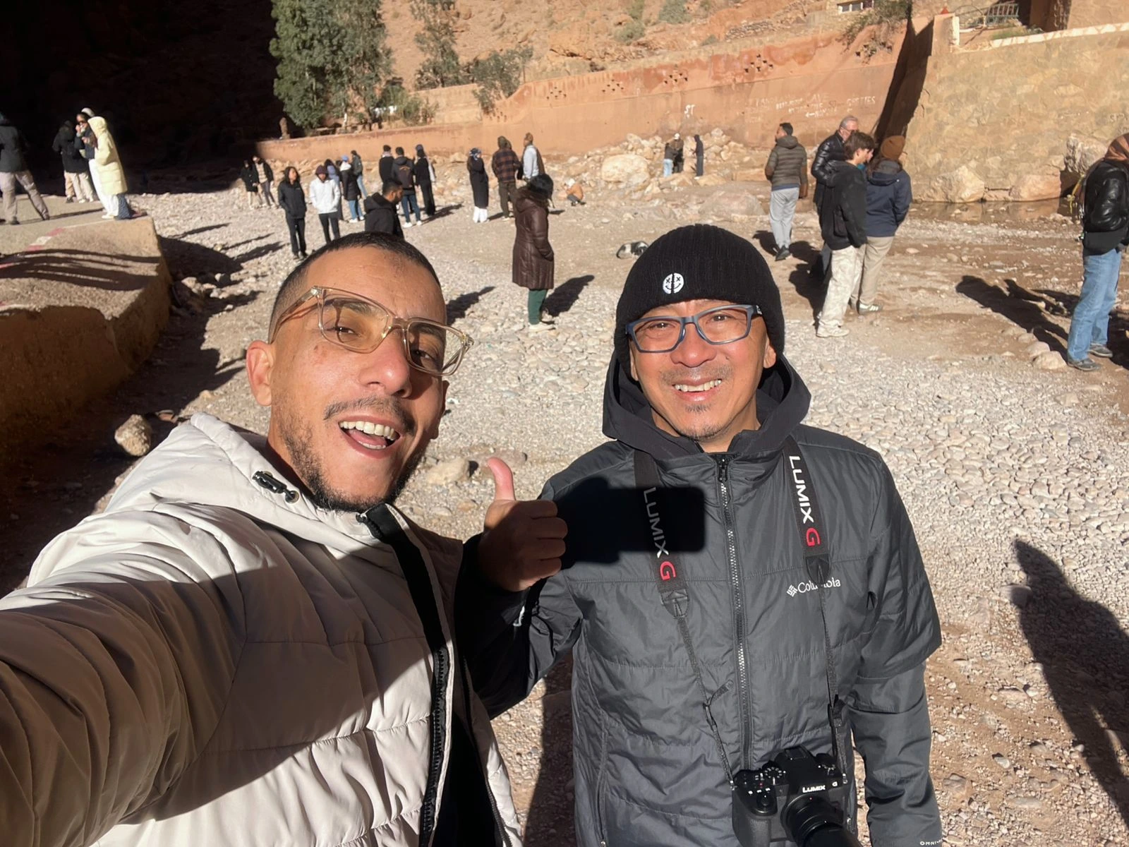 Todra Gorge Tour Morocco – Complete Guide with Local Experience Introduction to Todra Gorge, Morocco Todra Gorge (also called Todra Gorges) is one of the most spectacular natural attractions in southern Morocco. Located near the town of Tinghir, at the edge of the High Atlas Mountains, Todra Gorge is famous for its dramatic limestone canyon walls that rise up to 300 meters high, creating a breathtaking landscape loved by travelers from around the world. A Todra Gorge tour in Morocco is a must for visitors looking for natural beauty, authentic culture, and unforgettable photo opportunities during their Morocco journey. ⸻ Where Is Todra Gorge Located? Todra Gorge is situated in eastern Morocco, approximately: • 170 km from Ouarzazate • 90 km from Merzouga (Sahara Desert) • 15 km from Tinghir It is often included in private Morocco tours between the Sahara Desert, Dades Valley, and Ouarzazate. ⸻ Why Visit Todra Gorge on a Private Tour Choosing a private Todra Gorge tour with a local guide allows you to fully enjoy the site at your own pace. Benefits of a Private Todra Gorge Tour: • Flexible stops for photos and walking • Deeper explanation of local history and geology • Time to explore the palm oasis and Berber villages • Comfortable transport with a private driver • Ideal for families, couples, and small groups With Moroccan Odyssey, our tours focus on real experiences, not rushed visits. ⸻ The Natural Beauty of Todra Gorges The highlight of Todra Gorge is the narrow canyon, where massive rock walls close in to form a dramatic passage with a small river flowing through it. The contrast between red rock, green palm trees, and blue sky makes Todra Gorge one of the most photographed places in Morocco. Popular activities include: • Walking through the canyon • Photography • Light hiking • Rock climbing (Todra Gorge is world-famous for climbers) ⸻ Todra Gorge and Local Berber Culture A visit to Todra Gorge is not only about landscapes. The surrounding area is home to Berber communities who have lived here for centuries. Along your tour, you may see: • Traditional mud-brick villages • Palm groves fed by ancient irrigation systems • Local people selling handmade crafts and fossils Our local guides explain daily life, traditions, and history, making your Todra Gorge Morocco tour more meaningful. ⸻ Best Time to Visit Todra Gorge The best time to visit Todra Gorge is: • Spring (March–May): pleasant weather, green landscapes • Autumn (September–November): ideal temperatures and clear skies Summer can be hot, but Todra Gorge remains cooler than surrounding desert areas due to its canyon walls. ⸻ Todra Gorge as Part of a Morocco Desert Tour Many travelers visit Todra Gorge as part of a Sahara Desert tour from Marrakech or Fes. It fits perfectly between: • Merzouga Desert • Dades Valley • Ouarzazate and Ait Ben Haddou This makes Todra Gorge a key stop on classic Morocco desert tour itineraries. ⸻ Real Guest Experiences at Todra Gorge One of the best ways to understand the magic of Todra Gorge is through real guest experiences. Visiting with a knowledgeable local guide allows guests to feel safe, relaxed, and fully immersed in the environment. Photos taken during our tours show genuine moments of discovery, connection, and enjoyment — exactly what travelers look for when booking a Todra Gorge private tour in Morocco. Exploring Todra Gorge on a private Morocco tour with our local guide — real guest experience in the High Atlas Mountains. This photo captures a real moment from a Todra Gorge tour in Morocco, where our local guide accompanies guests through one of the most impressive natural landscapes in the High Atlas Mountains. Known for its towering canyon walls, palm oasis, and peaceful atmosphere, Todra Gorge is a highlight of many private Morocco tours. Visiting Todra Gorge with a knowledgeable local guide allows travelers to explore the area at a relaxed pace, learn about Berber culture, and enjoy authentic experiences away from crowded routes. At Moroccan Odyssey, we focus on personalized tours that create genuine connections and unforgettable memories across Morocco.