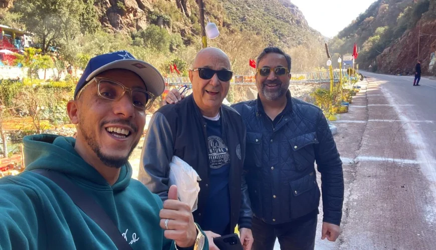 Local Moroccan tour guide with guests from Washington USA enjoying a stop in the Ourika Valley, High Atlas Mountains near Marrakech