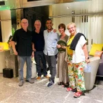 Guests enjoying a traditional Moroccan lunch with a local family in their home.