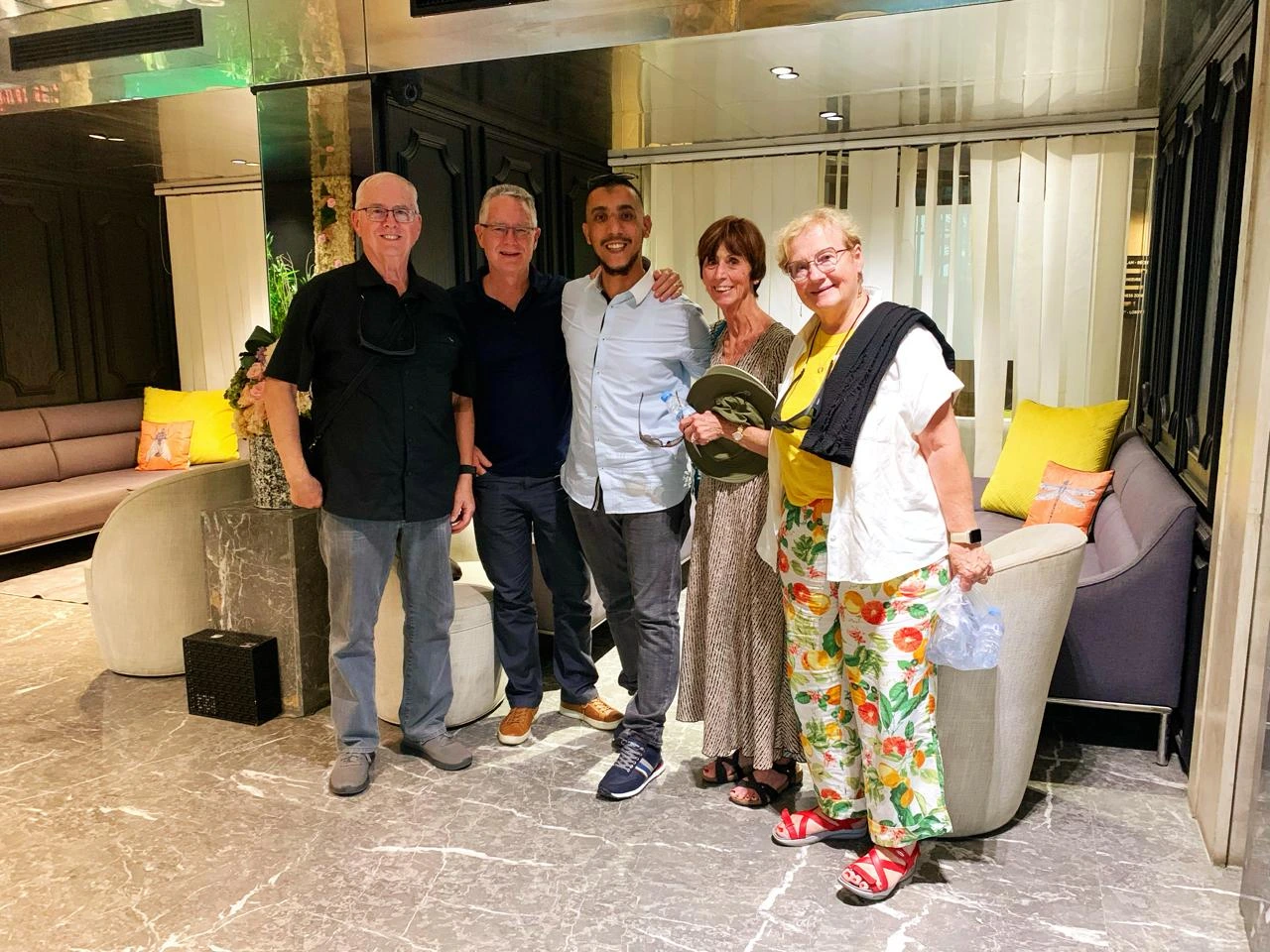 Guests enjoying a traditional Moroccan lunch with a local family in their home.