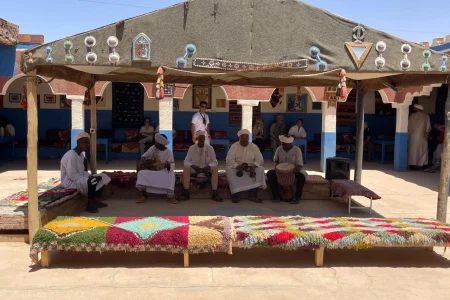 Traditional Gnawa musicians performing in a Berber nomad village in the Sahara Desert of Morocco near Merzouga.