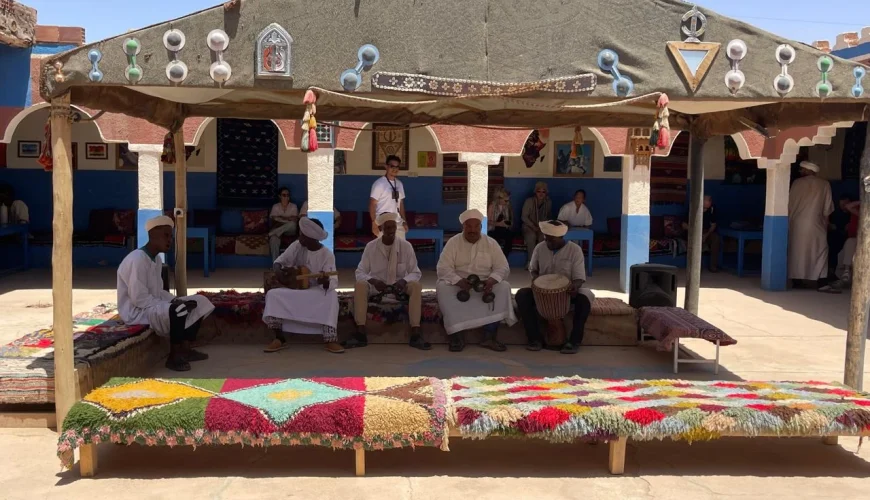 Traditional Gnawa musicians performing in a Berber nomad village in the Sahara Desert of Morocco near Merzouga.