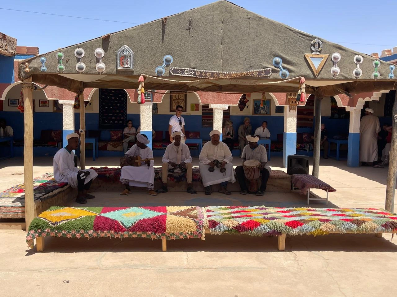 Traditional Gnawa musicians performing in a Berber nomad village in the Sahara Desert of Morocco near Merzouga.