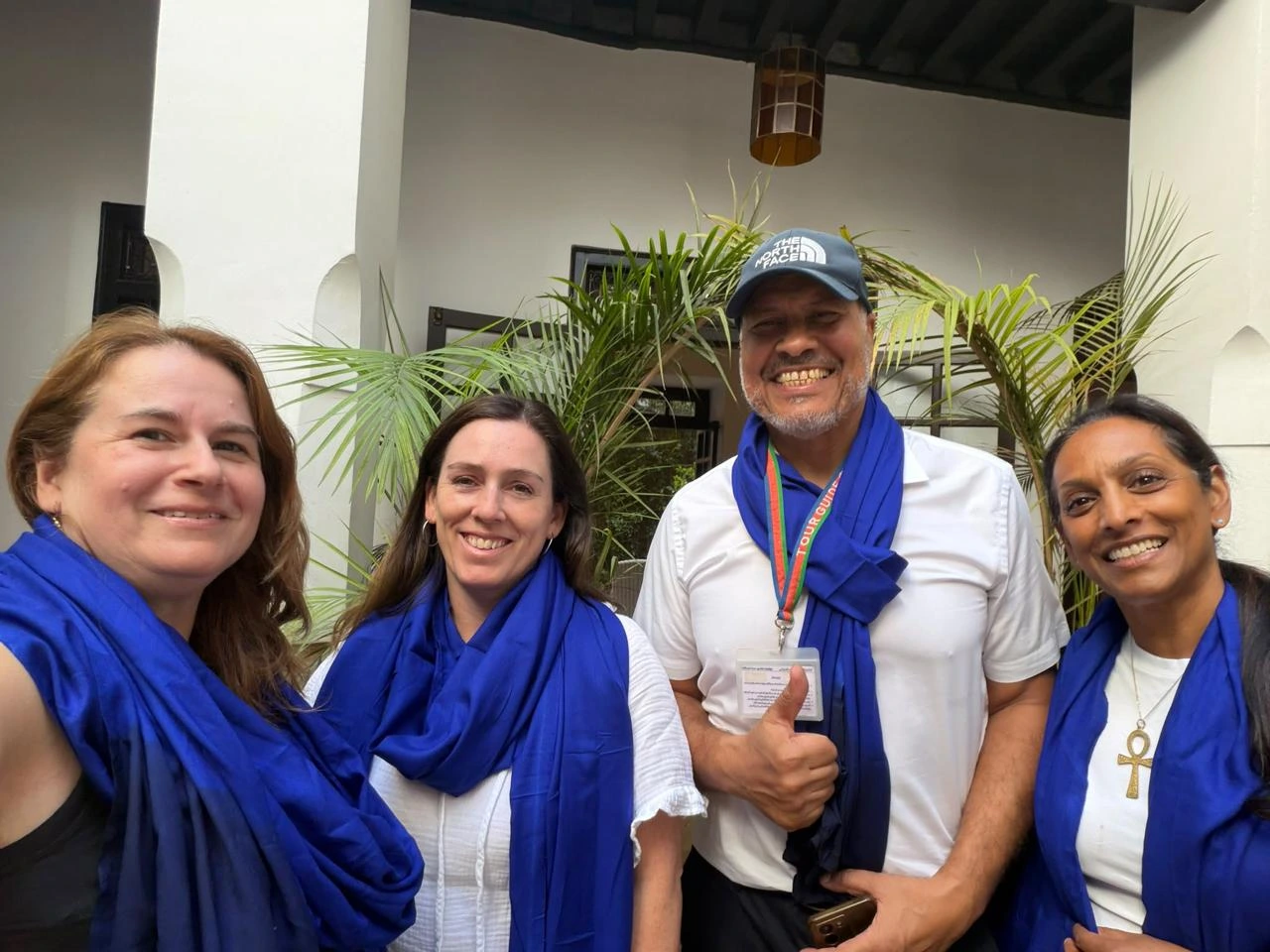 Moroccan Odyssey local guide with guests after a private walking tour in Marrakech, Morocco.